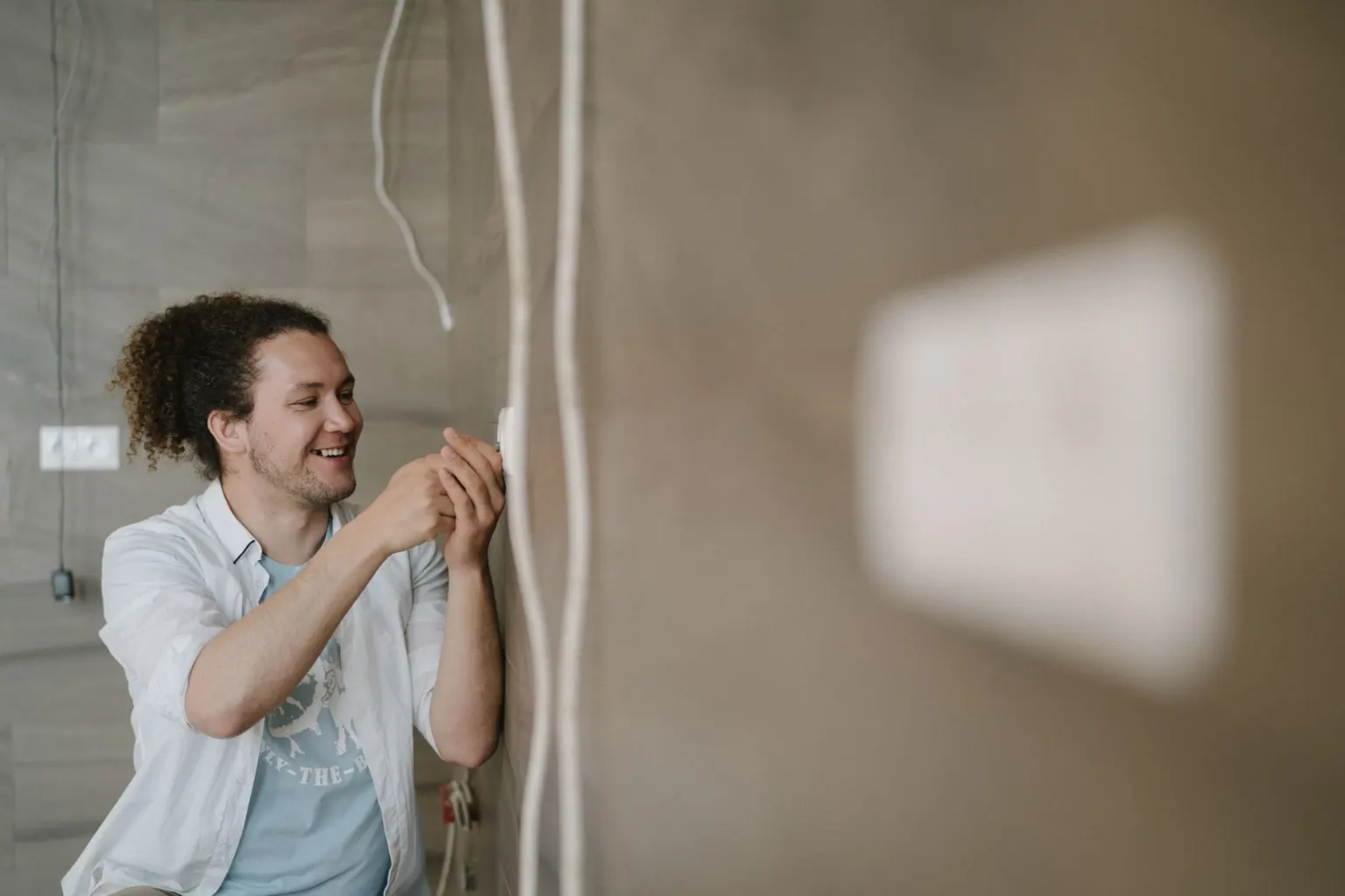 Electrician working on a socket during electrical testing