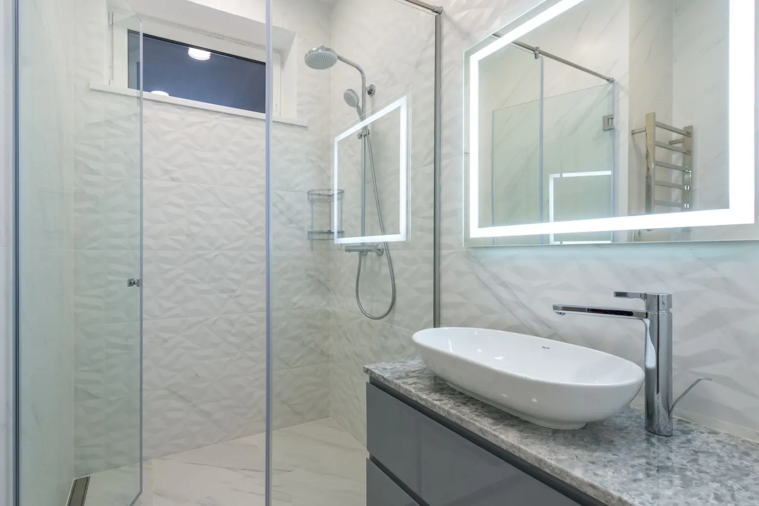 Renovated bathroom with a tiled walk-in shower