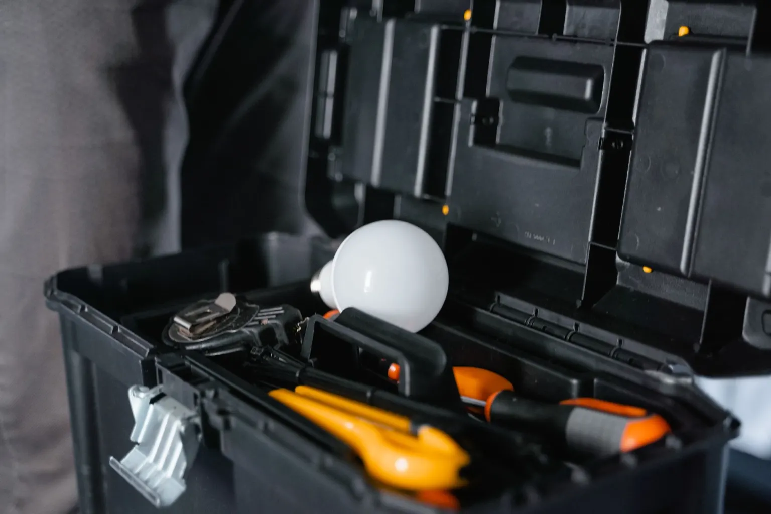 Tradesperson with tools carrying out a home repair
